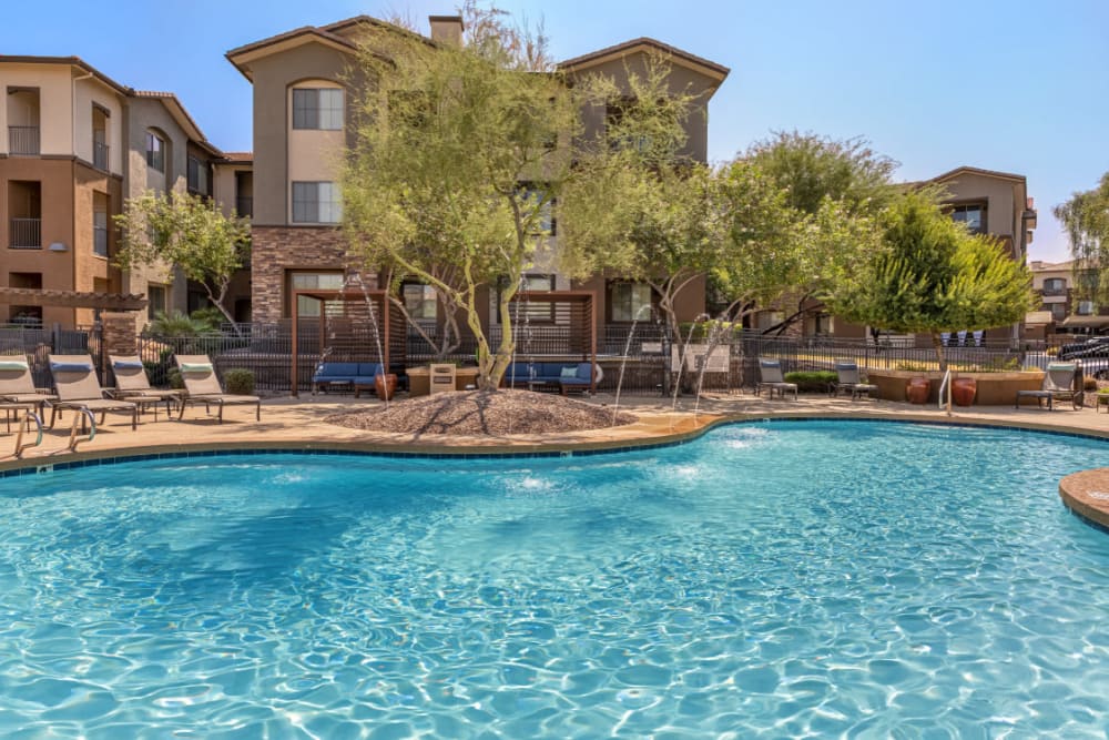 Sparkling resort style pool with water features at Marquis at Sonoran Preserve in Phoenix, Arizona