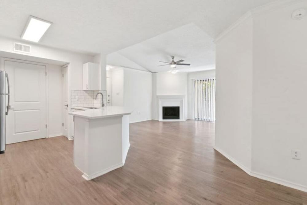 Living room with view of kitchen at Vail Cliffside in Arlington. TX