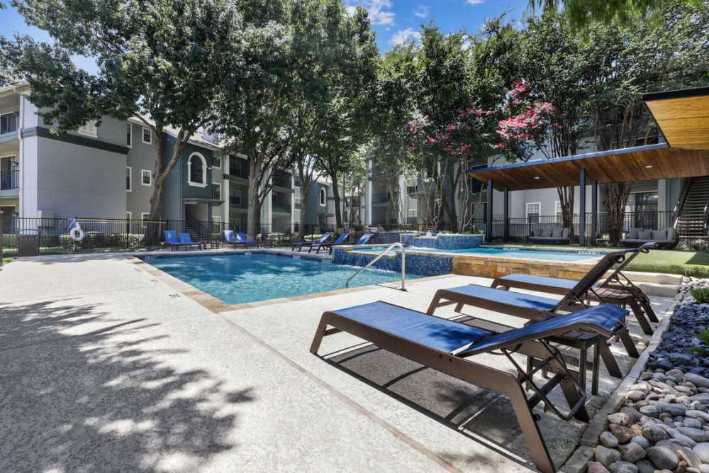 View of pool area with patio at Vail Cliffside in Arlington. TX