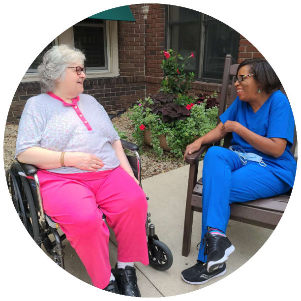 Resident laughing with an employee at Ebenezer Senior Living in Edina, Minnesota