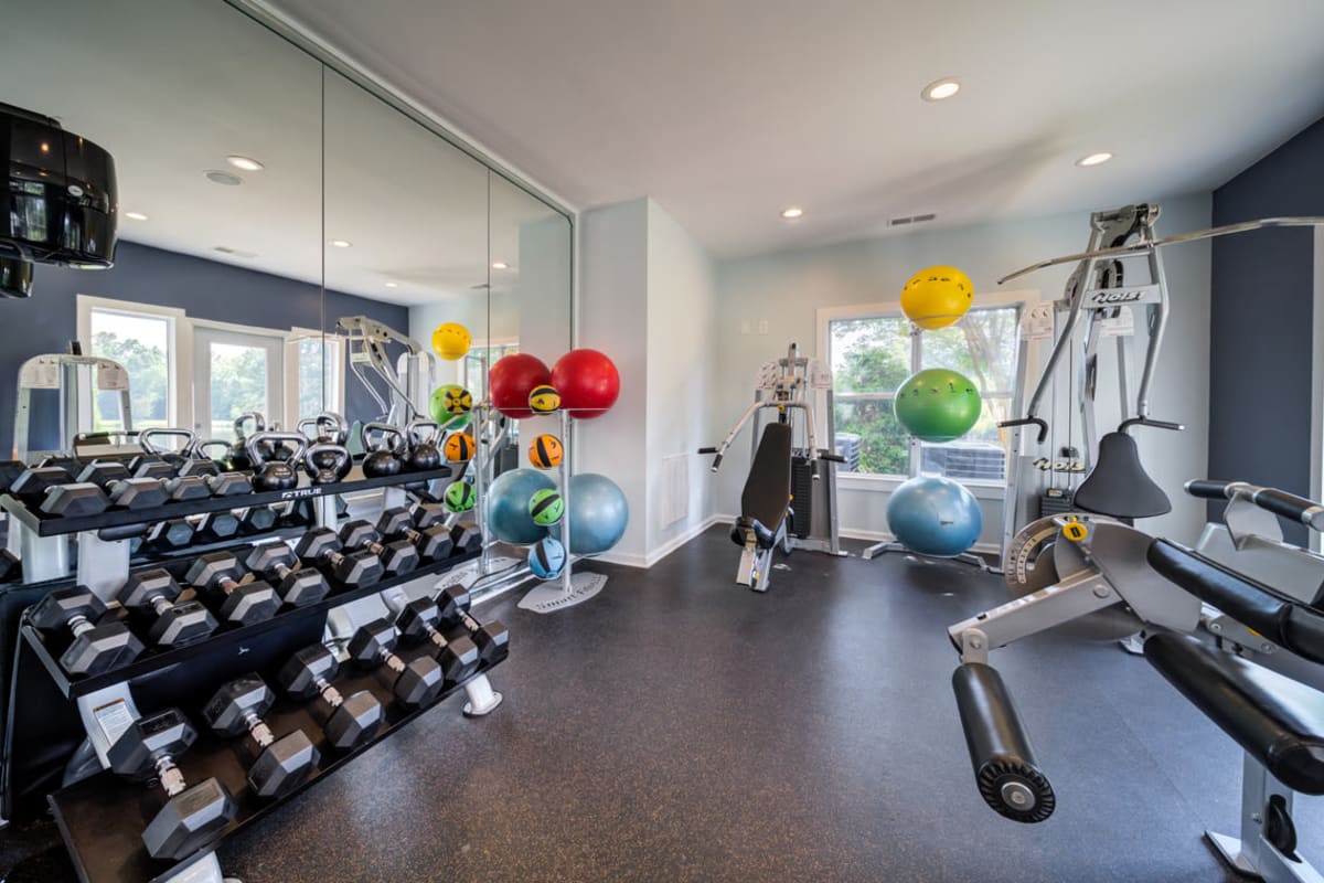 Weights in the fitness center at One Norman Square in Cornelius, North Carolina
