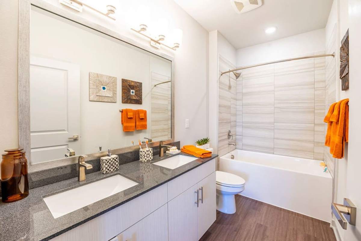 Bathroom with wood-style flooring at Caliber at Flatirons in Broomfield, Colorado