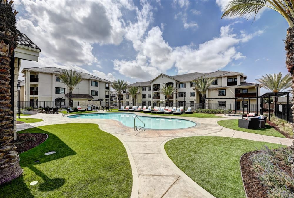 Resort-style swimming pool area at the Palms at Morada property in Stockton, California, developed and managed by American Property Management in Bellevue, Washington