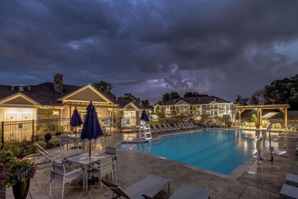 Swimming pool at night at Avanti Luxury Apartments in Bel Air, Maryland