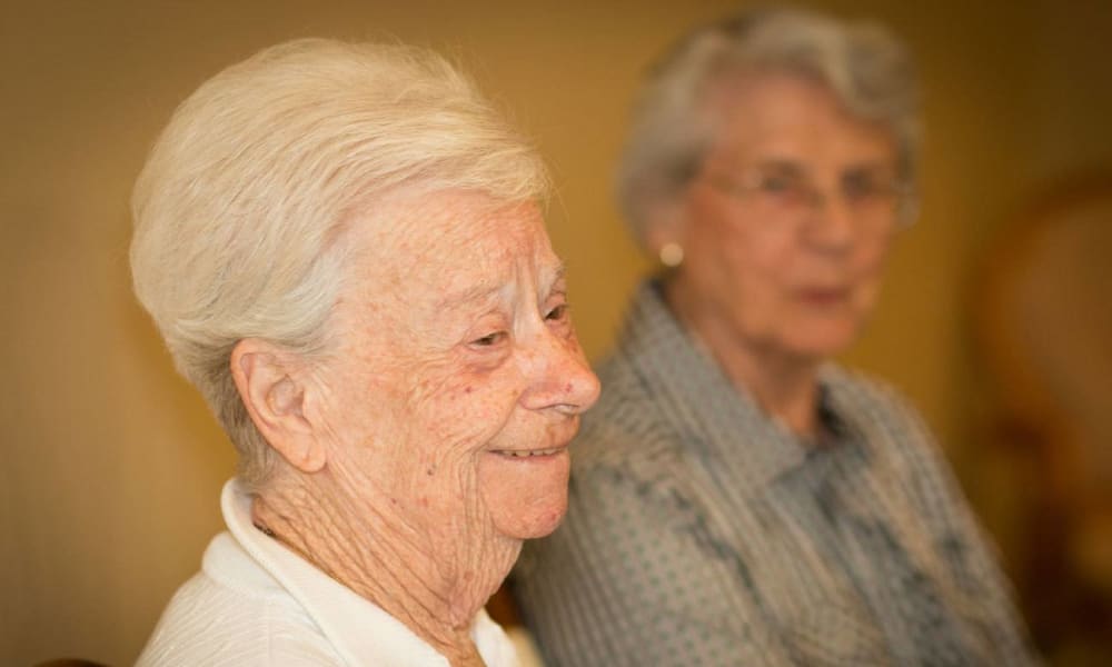 Resident sitting and smiling at Governor's Port in Mentor, Ohio