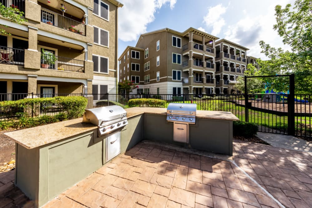 Stainless steel BBQs in enclosed area at Marquis at Stone Oak in San Antonio, Texas