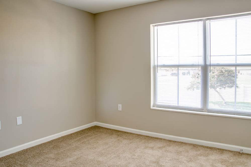 Bedroom with a large window at Brennan Pointe I in Newport News, Virginia