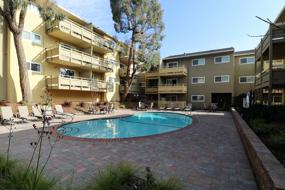 Sparkling pool and deck at Bayfair Apartment Homes in San Lorenzo, California