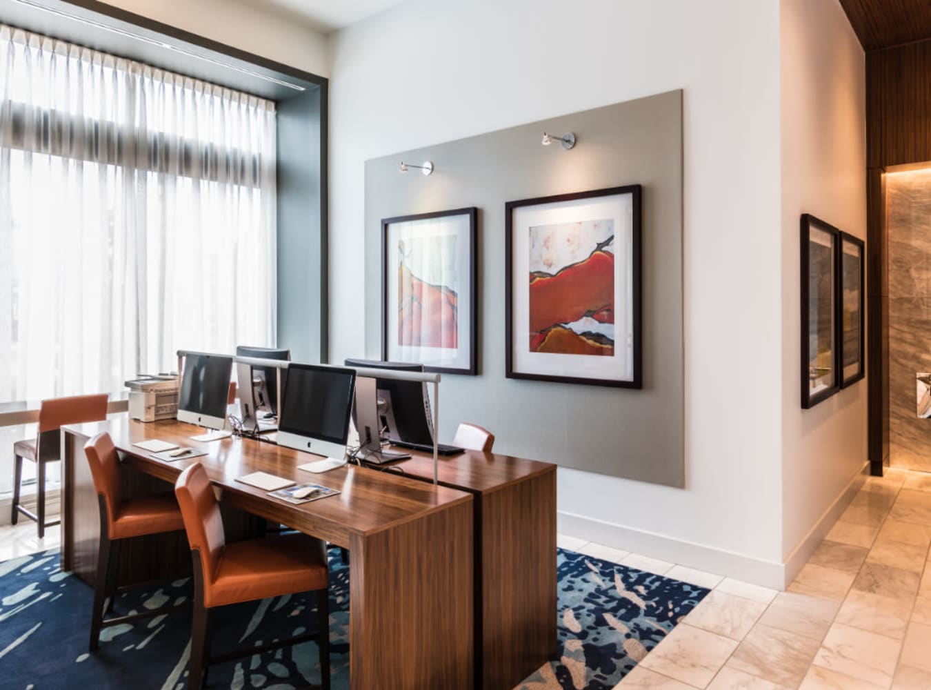 A business center with personal computers at Solaire 7077 Woodmont in Bethesda, Maryland