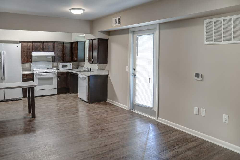 Open kitchen and spacious living room of apartment home at Bell Diamond Manor in Norfolk, Virginia