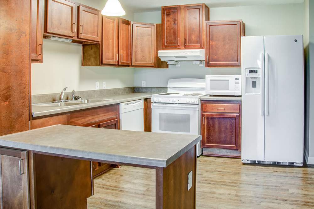 Kitchen with a breakfast counter at Brennan Pointe I in Newport News, Virginia
