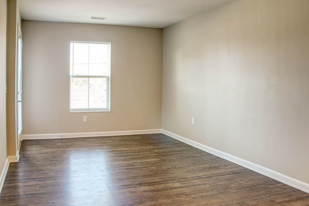 Well-lit bedroom room at Brennan Pointe I in Newport News, Virginia