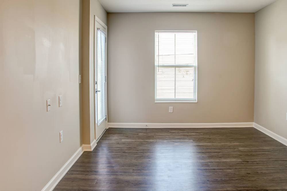 Bedroom with wood-style flooring at Brennan Pointe I in Newport News, Virginia