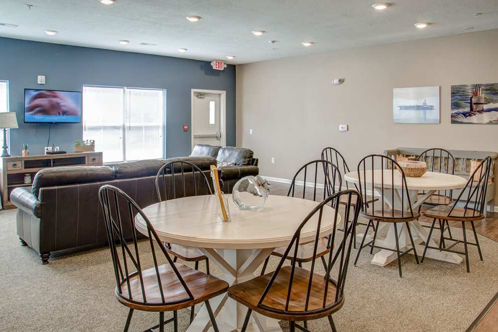 Community room with a TV and a couch at Brennan Pointe I in Newport News, Virginia