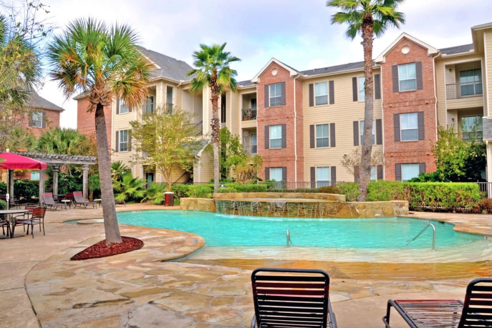 Poolside seating at Compass at Windmill Lakes in Houston, Texas