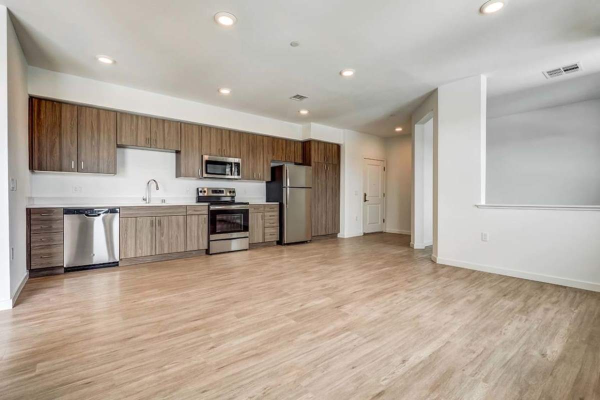 Kitchen with hardware flooring at Ageno Apartments in Livermore, California