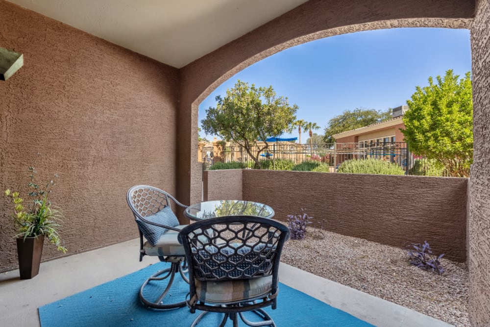 Private patio seating with plants and gravel landscape at Alante at the Islands in Chandler, Arizona