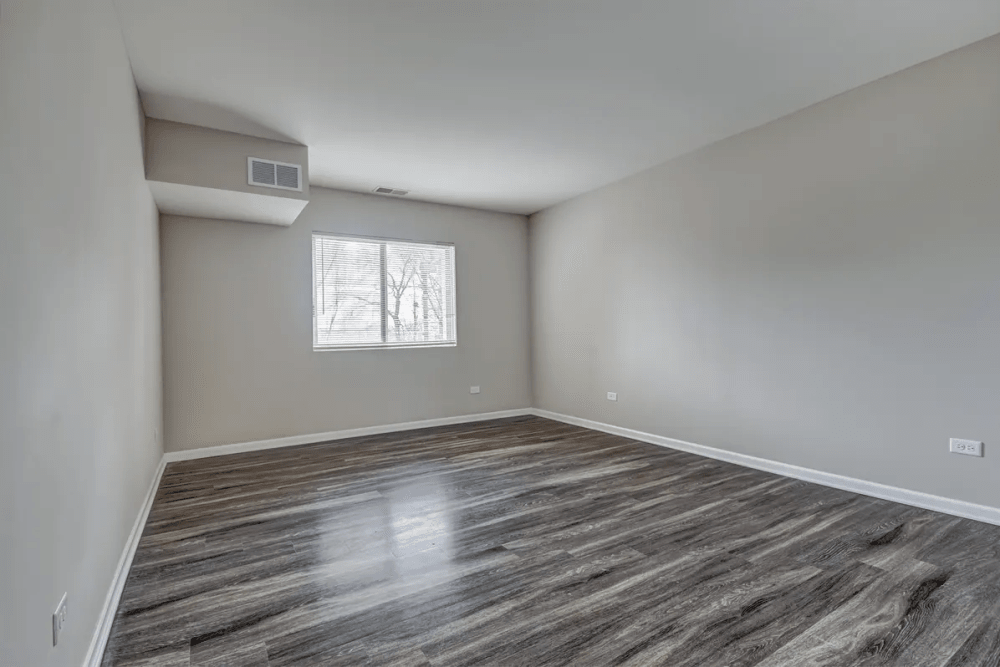 Bedroom with wood flooring at Stonebridge in Arlington Heights, Illinois