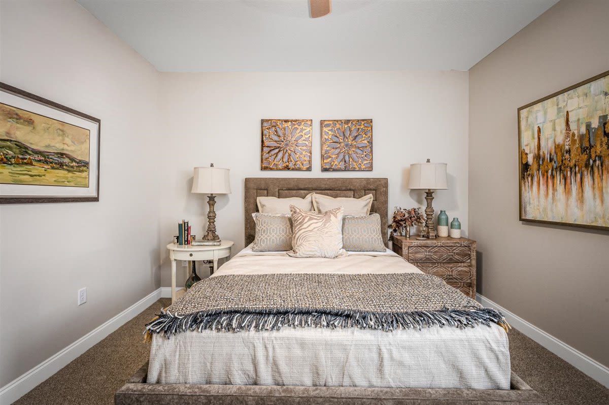 A queen sized bed in bedroom at Bowman Station in Macon, Georgia