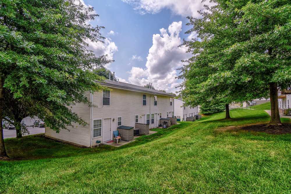 Apartment building with grassy slopen at Greene Glen in Morgantown. WV