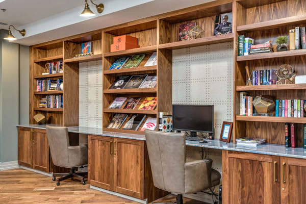 Lounging area with bookshelves at Anthology of Clayton View in Saint Louis, Missouri