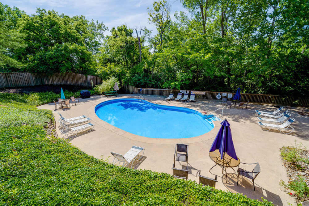 Community pool area with lounge chairs at Carriage Court in Cincinnati, Ohio