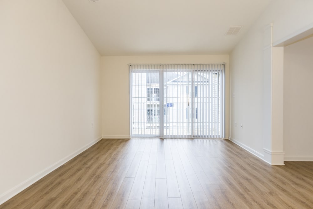 Wood flooring and balcony access at The Greens at Sunchase in Farmville, Virginia