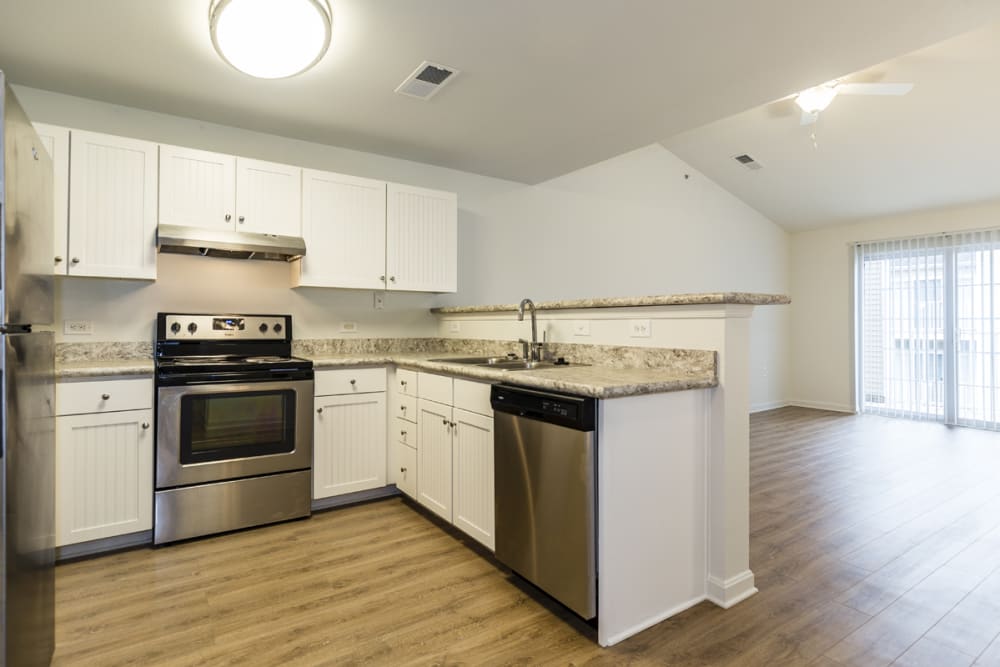 Kitchen with granite countertops at The Greens at Sunchase in Farmville, Virginia