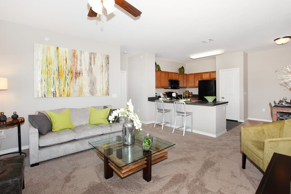 Open-concept living room and kitchen at Outlook Ridge in Pueblo, Colorado