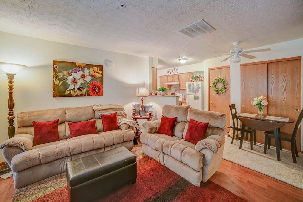 Furnished living room with sofa and love seat at Braddocks Greene in Frostburg, Maryland