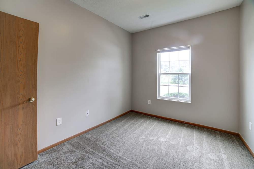 Window and carpet flooring of bedroom at Ridgewood Greene in Reynoldsville, Pennsylvania