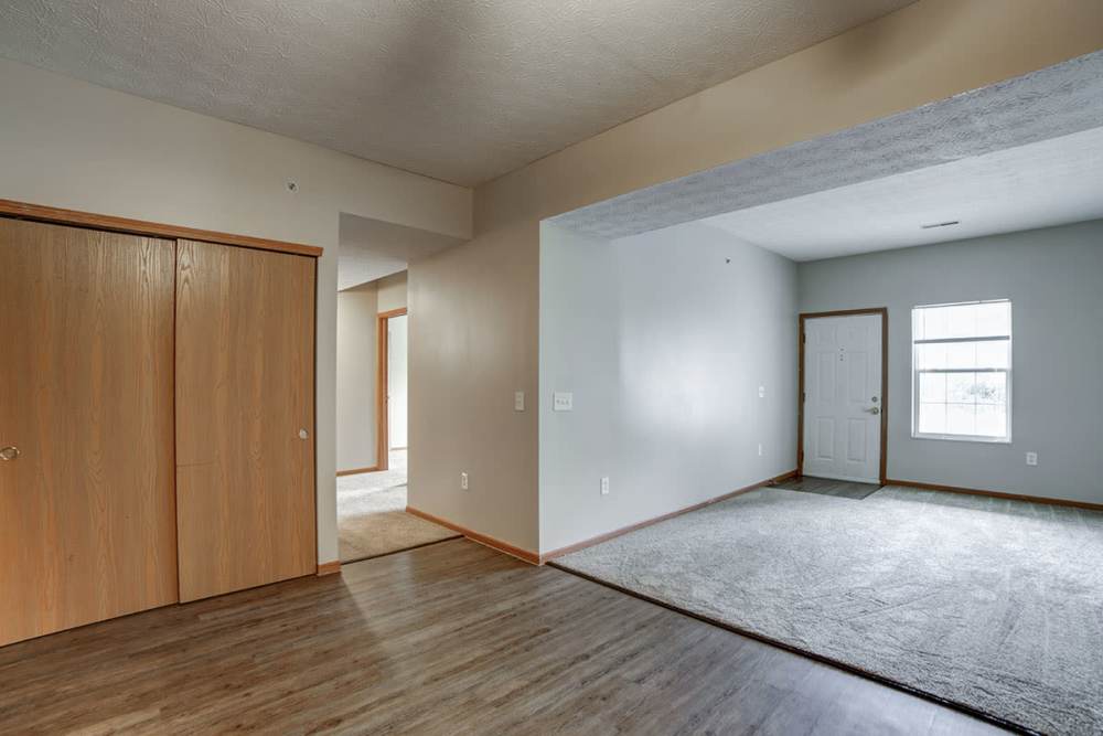 Wood-style flooring and hallway of apartment at Ridgewood Greene in Reynoldsville, Pennsylvania