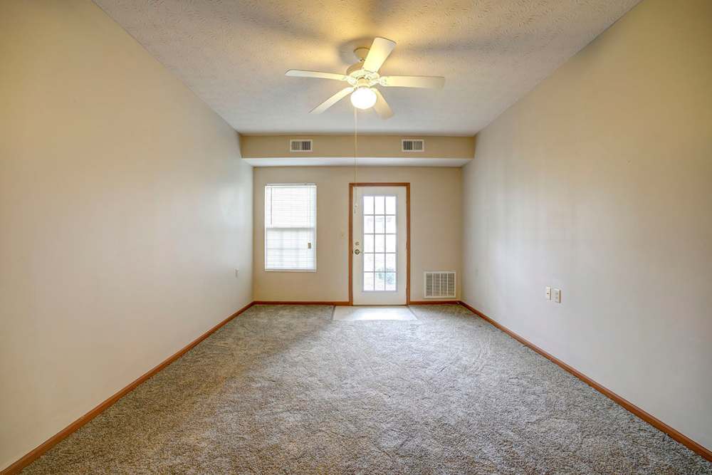 Ceiling fan in the carpet floored living space at Brentwood Greene in Kokomo, Indiana