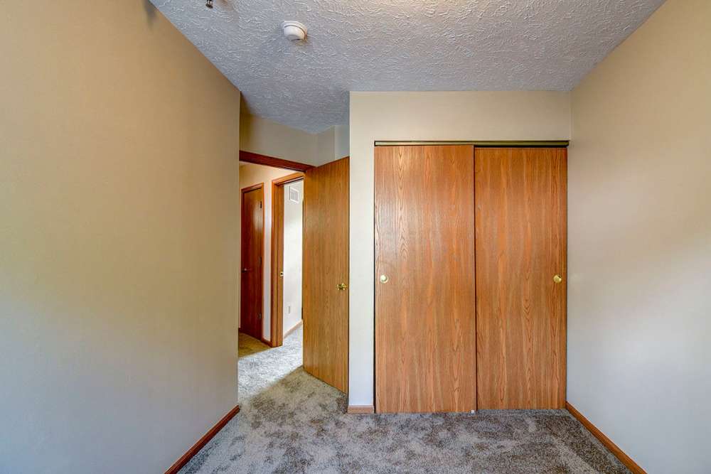 Unfurnished room with carept flooring and hallway at Greene Glen in Morgantown. WV