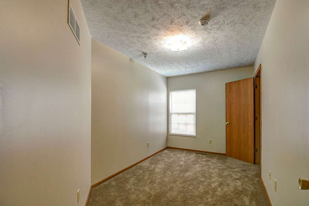 In home room with winow and carpet flooring at Greene Glen in Morgantown. WV