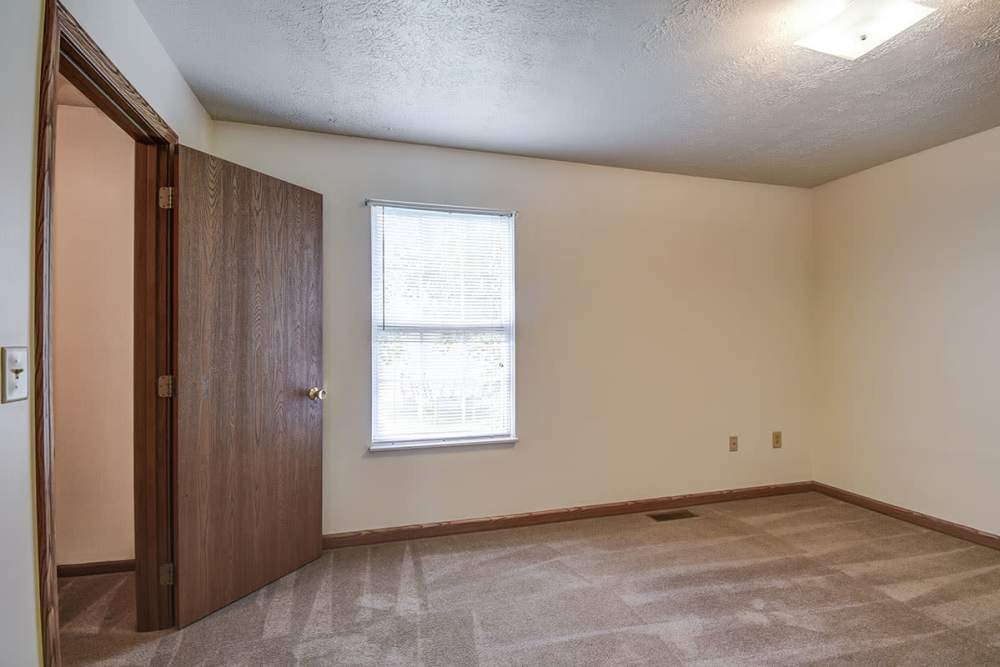 Well-lit apartment bedroom at Greene Gables in Ridgeley, West Virginia