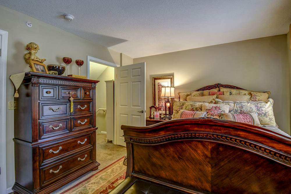 Well it bedroom with lamp light at Oak Valley Gardens in Glenville. WV