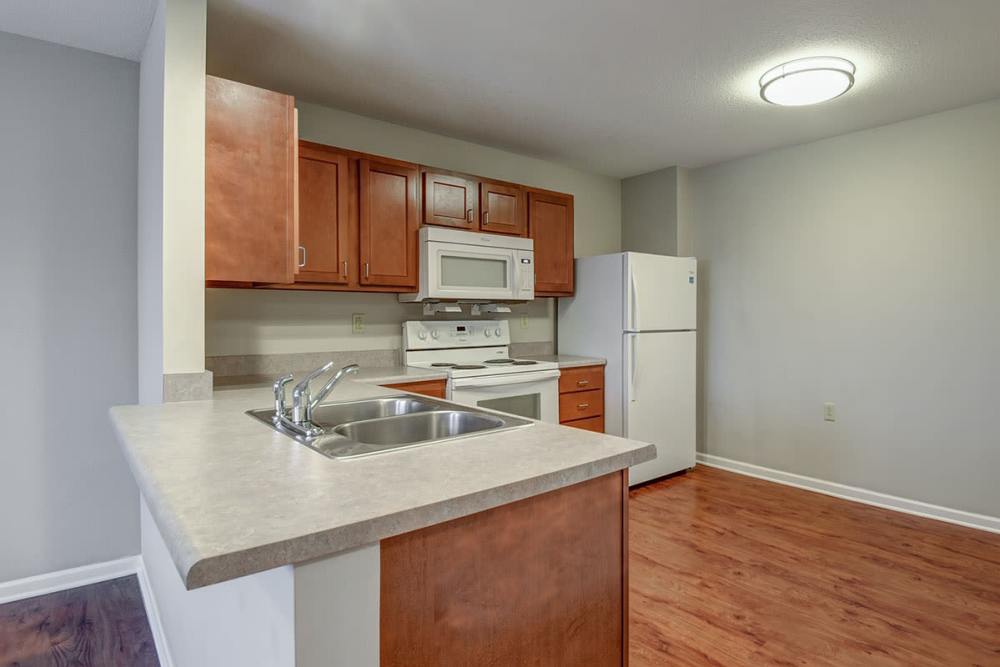 Kitchen with white appliances at Pringle House Senior Living in Buckhannon, West Virginia