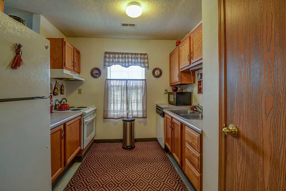 kitchen with white appliances at St. Paul Terrace in Parkersburg, West Virginia