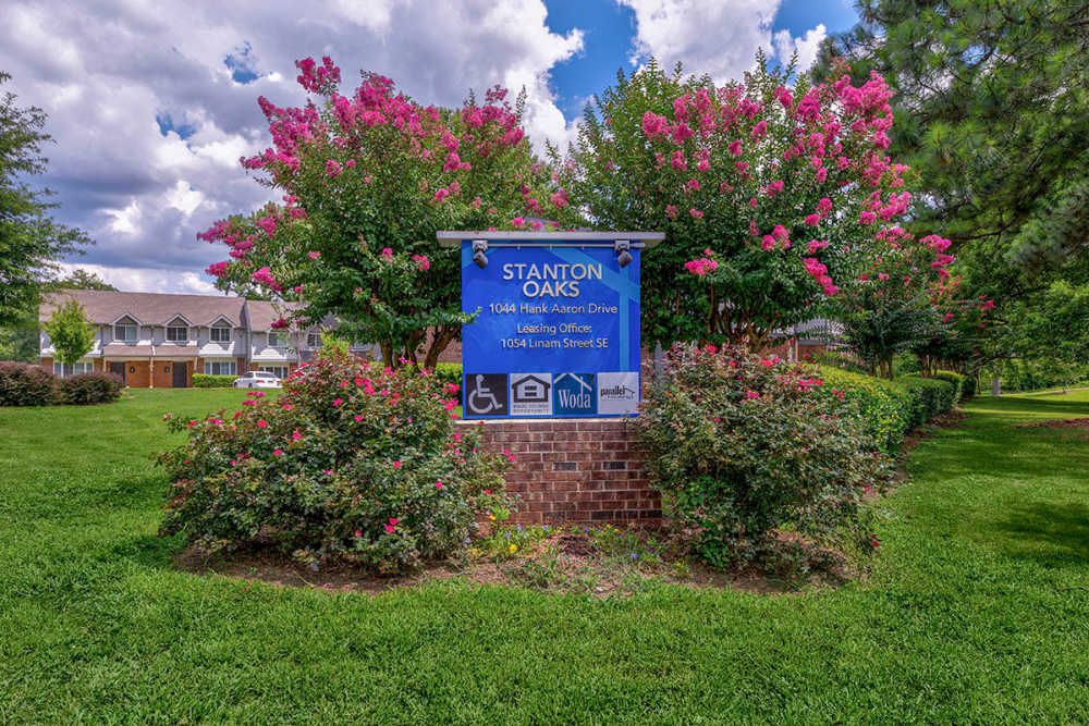 Property exterior view with signage at Stanton Oaks in Atlanta, Georgia