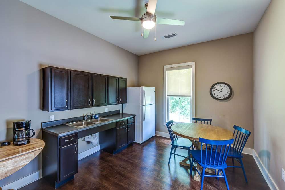 Community kitchen and dining space at Silver Lakes in Madison, Georgia