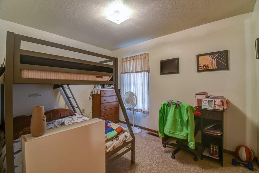 Bedroom with study table and bunk bed at Yellowbud Place in Moorefield, West Virginia