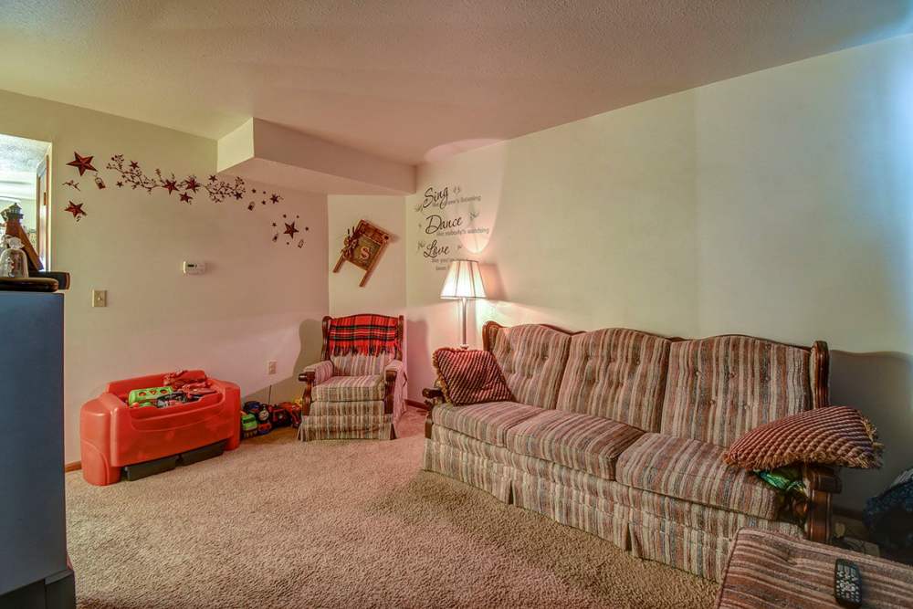 Living room with sofa and couches at Yellowbud Place in Moorefield, West Virginia
