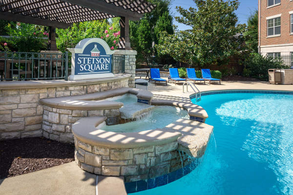 Swimming pool with a fountain at The Village at Stetson Square in Cincinnati, Ohio