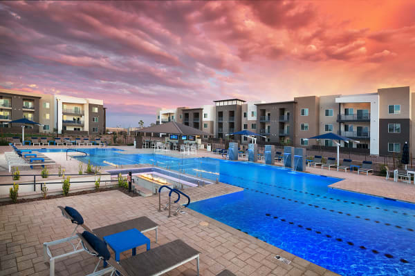 Building exterior and community pool at Sky at Chandler Airpark in Chandler, Arizona