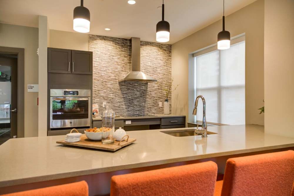 Community clubhouse kitchen with stainless-steel appliances at Gateway North in Lynn, Massachusetts