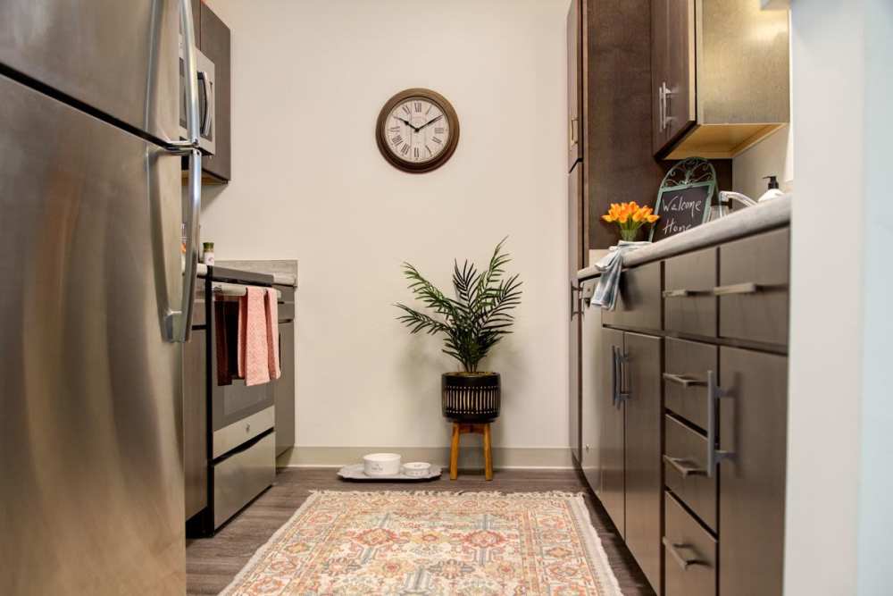 Fully-equipped kitchen with wood-style flooring at Gateway North in Lynn, Massachusetts