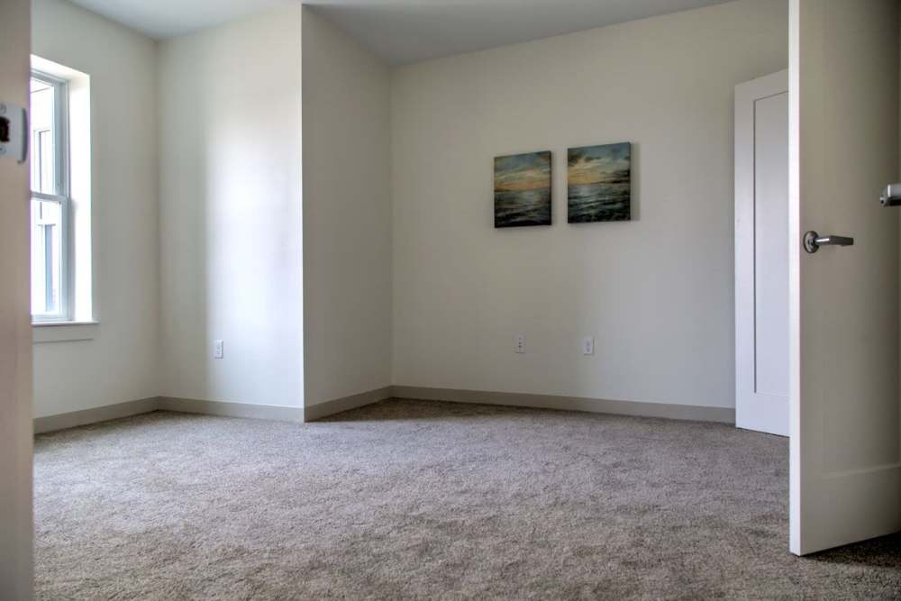 Unfurnished bedroom with carpet flooring at Gateway North in Lynn, Massachusetts