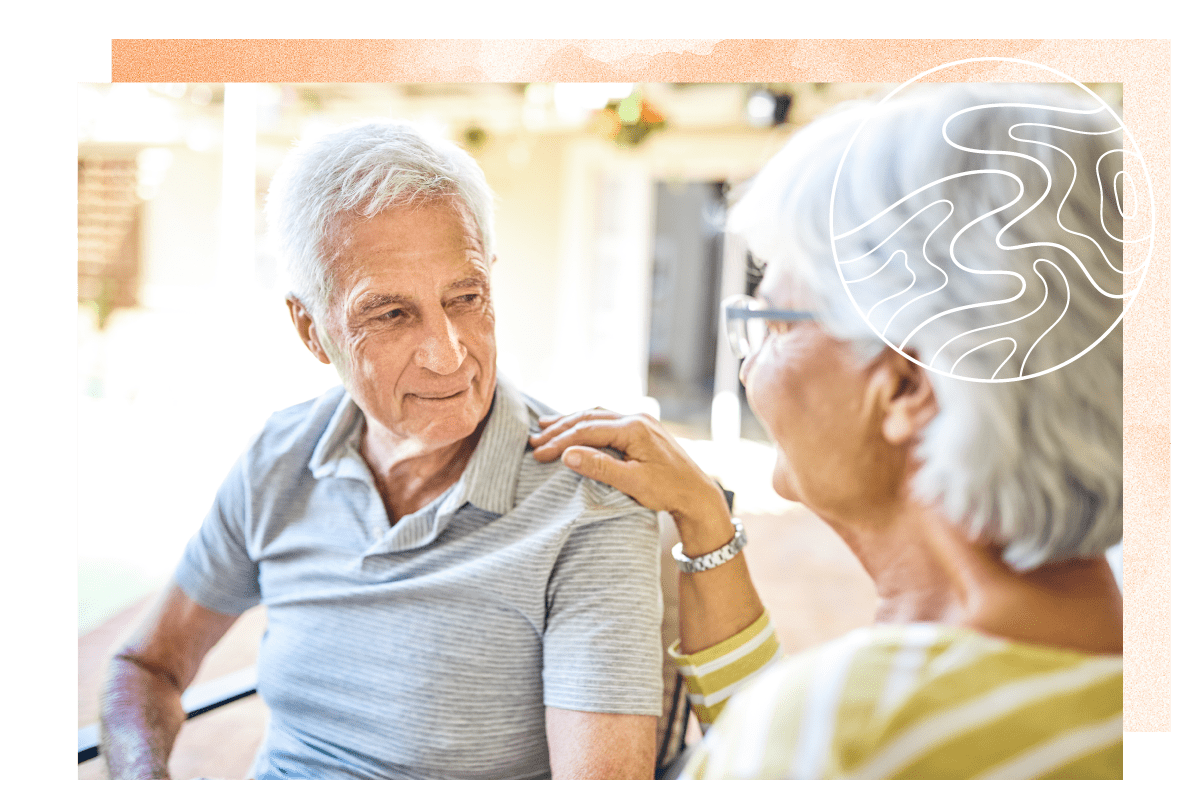 Resident couple sitting in a lounge at a MBK Senior Living community