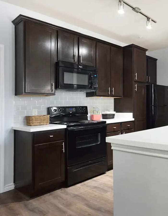 Kitchen with chef's island at Midtown 905 in Denton, Texas